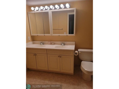 ELEGANT, IMMACULATE AND SPACIOUS UNIT WITH SERENE VIEWS OF GOLF on Wynmoor Golf Course in Florida - for sale on GolfHomes.com, golf home, golf lot