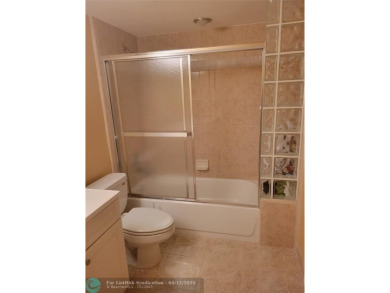 ELEGANT, IMMACULATE AND SPACIOUS UNIT WITH SERENE VIEWS OF GOLF on Wynmoor Golf Course in Florida - for sale on GolfHomes.com, golf home, golf lot