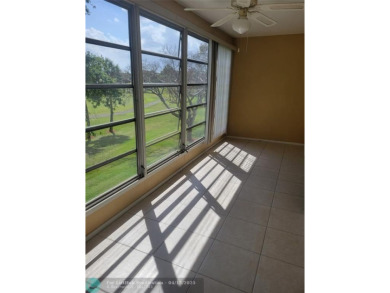 ELEGANT, IMMACULATE AND SPACIOUS UNIT WITH SERENE VIEWS OF GOLF on Wynmoor Golf Course in Florida - for sale on GolfHomes.com, golf home, golf lot