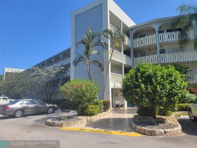 ELEGANT, IMMACULATE AND SPACIOUS UNIT WITH SERENE VIEWS OF GOLF on Wynmoor Golf Course in Florida - for sale on GolfHomes.com, golf home, golf lot