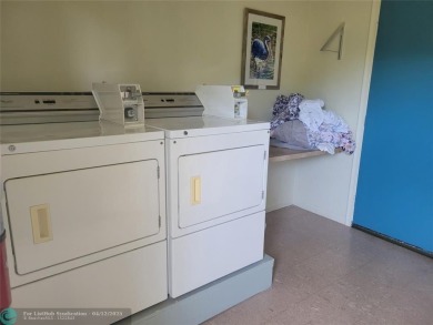 ELEGANT, IMMACULATE AND SPACIOUS UNIT WITH SERENE VIEWS OF GOLF on Wynmoor Golf Course in Florida - for sale on GolfHomes.com, golf home, golf lot