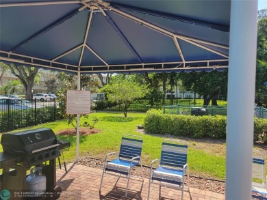 ELEGANT, IMMACULATE AND SPACIOUS UNIT WITH SERENE VIEWS OF GOLF on Wynmoor Golf Course in Florida - for sale on GolfHomes.com, golf home, golf lot
