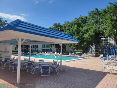 ELEGANT, IMMACULATE AND SPACIOUS UNIT WITH SERENE VIEWS OF GOLF on Wynmoor Golf Course in Florida - for sale on GolfHomes.com, golf home, golf lot
