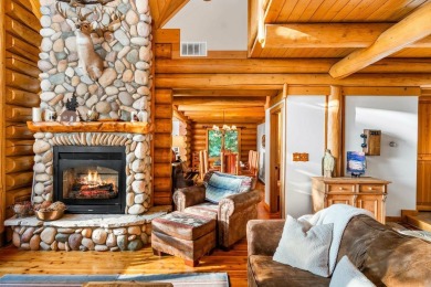 Welcome to this stunning Up North luxury log home perfectly on Boyne Mountain Resort - Monument Course in Michigan - for sale on GolfHomes.com, golf home, golf lot