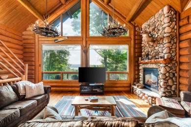 Welcome to this stunning Up North luxury log home perfectly on Boyne Mountain Resort - Monument Course in Michigan - for sale on GolfHomes.com, golf home, golf lot