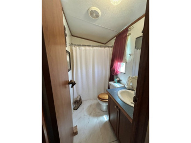 Nice and Open 3 bedroom 2 bath Manufactured home. Large backyard on Mountain Creek Golf Club in Texas - for sale on GolfHomes.com, golf home, golf lot