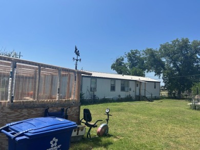 Nice and Open 3 bedroom 2 bath Manufactured home. Large backyard on Mountain Creek Golf Club in Texas - for sale on GolfHomes.com, golf home, golf lot