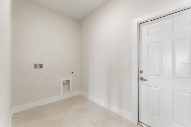 STUNNING NEW CONSTRUCTION HOME in Indian Lake Estates - Golf on Indian Lake Estates Golf and Country Club in Florida - for sale on GolfHomes.com, golf home, golf lot