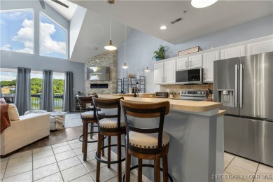 Experience lake life at its finest in this stunning 4-bedroom on The Club At Old Kinderhook in Missouri - for sale on GolfHomes.com, golf home, golf lot