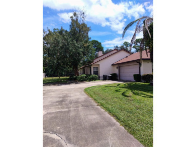 Custom built 3-bedroom, 2-bathroom masonry-built home nestled on on Glen Abbey Golf Club in Florida - for sale on GolfHomes.com, golf home, golf lot