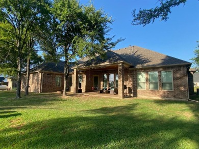 Gorgeous 3 bedroom 3.5 bath plus office home sitting on almost a on Cedar Creek Country Club in Texas - for sale on GolfHomes.com, golf home, golf lot