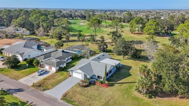 One or more photo(s) has been virtually staged. Nestled in a on Palm Harbor Golf Club in Florida - for sale on GolfHomes.com, golf home, golf lot