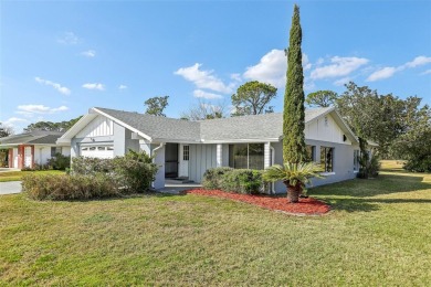 One or more photo(s) has been virtually staged. Nestled in a on Palm Harbor Golf Club in Florida - for sale on GolfHomes.com, golf home, golf lot