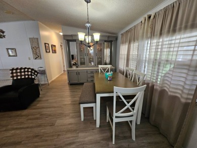 Located in Cypress Lakes Village in a 55+ resort style MH on Big Cypress Golf and Country Club in Florida - for sale on GolfHomes.com, golf home, golf lot
