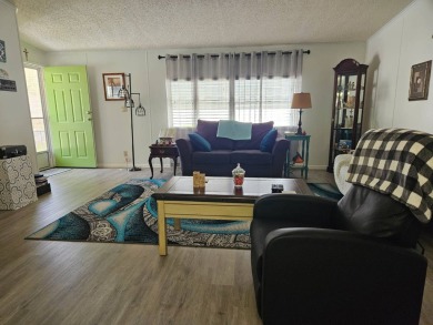 Located in Cypress Lakes Village in a 55+ resort style MH on Big Cypress Golf and Country Club in Florida - for sale on GolfHomes.com, golf home, golf lot