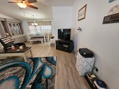 Located in Cypress Lakes Village in a 55+ resort style MH on Big Cypress Golf and Country Club in Florida - for sale on GolfHomes.com, golf home, golf lot