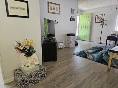 Located in Cypress Lakes Village in a 55+ resort style MH on Big Cypress Golf and Country Club in Florida - for sale on GolfHomes.com, golf home, golf lot