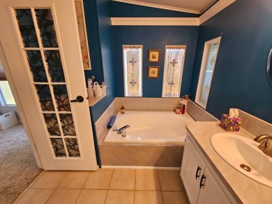 Located in Cypress Lakes Village in a 55+ resort style MH on Big Cypress Golf and Country Club in Florida - for sale on GolfHomes.com, golf home, golf lot