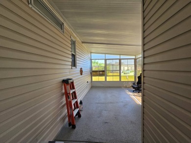 Located in Cypress Lakes Village in a 55+ resort style MH on Big Cypress Golf and Country Club in Florida - for sale on GolfHomes.com, golf home, golf lot