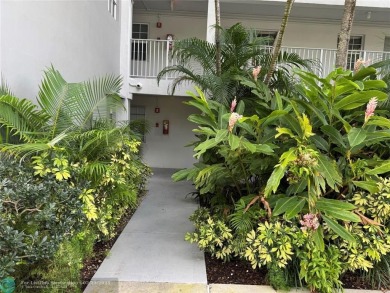 Convenient first floor unit condo in the tropical Palm Aire on Palm-Aire Country Club and Resort - The Oaks in Florida - for sale on GolfHomes.com, golf home, golf lot