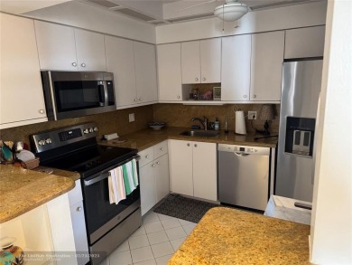 Convenient first floor unit condo in the tropical Palm Aire on Palm-Aire Country Club and Resort - The Oaks in Florida - for sale on GolfHomes.com, golf home, golf lot