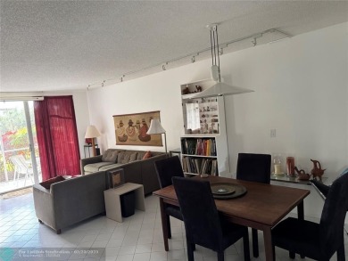 Convenient first floor unit condo in the tropical Palm Aire on Palm-Aire Country Club and Resort - The Oaks in Florida - for sale on GolfHomes.com, golf home, golf lot