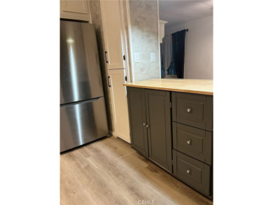 Beautifully updated and move-in ready, this 2-bedroom, 2-bath on Colonial Country Club in California - for sale on GolfHomes.com, golf home, golf lot