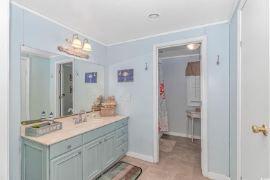 This very open and spacious 4-Bedroom, 2 Bath beach house is on Prestwick Country Club in South Carolina - for sale on GolfHomes.com, golf home, golf lot