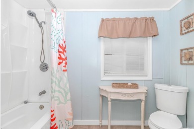 This very open and spacious 4-Bedroom, 2 Bath beach house is on Prestwick Country Club in South Carolina - for sale on GolfHomes.com, golf home, golf lot