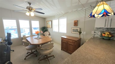 PRICE IMPROVEMENT ON THIS MOVE-IN READY, OPEN CONCEPT MOBILE on River Run Golf Links in Florida - for sale on GolfHomes.com, golf home, golf lot