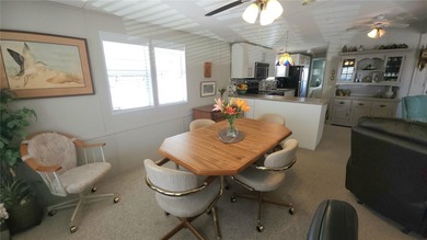 PRICE IMPROVEMENT ON THIS MOVE-IN READY, OPEN CONCEPT MOBILE on River Run Golf Links in Florida - for sale on GolfHomes.com, golf home, golf lot