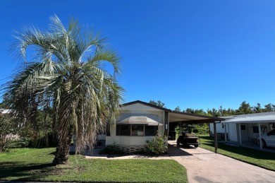 Cozy furnished home with no rear neighbors, ready for you to on Lake Henry Golf Club in Florida - for sale on GolfHomes.com, golf home, golf lot
