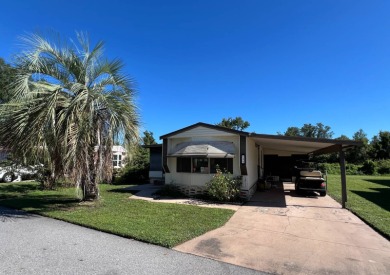 Cozy furnished home with no rear neighbors, ready for you to on Lake Henry Golf Club in Florida - for sale on GolfHomes.com, golf home, golf lot