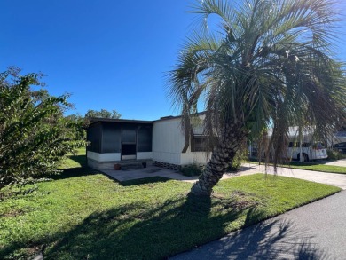 Cozy furnished home with no rear neighbors, ready for you to on Lake Henry Golf Club in Florida - for sale on GolfHomes.com, golf home, golf lot