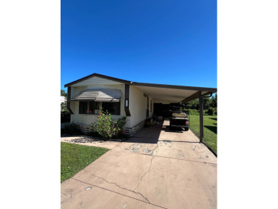 Cozy furnished home with no rear neighbors, ready for you to on Lake Henry Golf Club in Florida - for sale on GolfHomes.com, golf home, golf lot