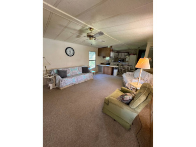 Cozy furnished home with no rear neighbors, ready for you to on Lake Henry Golf Club in Florida - for sale on GolfHomes.com, golf home, golf lot
