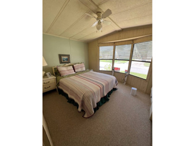 Cozy furnished home with no rear neighbors, ready for you to on Lake Henry Golf Club in Florida - for sale on GolfHomes.com, golf home, golf lot
