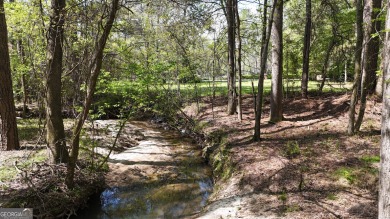 Nestled within the prestigious gated community of Whitewater on Whitewater Creek in Georgia - for sale on GolfHomes.com, golf home, golf lot