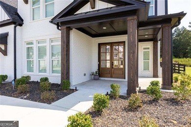 Welcome home to this executive home built by the Toll Brothers on Capital City Club Crabapple in Georgia - for sale on GolfHomes.com, golf home, golf lot