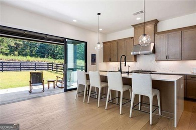 Welcome home to this executive home built by the Toll Brothers on Capital City Club Crabapple in Georgia - for sale on GolfHomes.com, golf home, golf lot