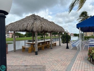 Beautiful water view updated 1 bedroom, 1  1/2  bath condo on Sunrise Lakes Phase III in Florida - for sale on GolfHomes.com, golf home, golf lot