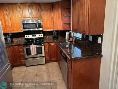 Beautiful water view updated 1 bedroom, 1  1/2  bath condo on Sunrise Lakes Phase III in Florida - for sale on GolfHomes.com, golf home, golf lot