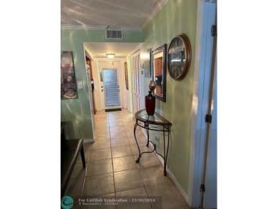 Beautiful water view updated 1 bedroom, 1  1/2  bath condo on Sunrise Lakes Phase III in Florida - for sale on GolfHomes.com, golf home, golf lot