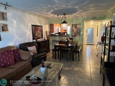Beautiful water view updated 1 bedroom, 1  1/2  bath condo on Sunrise Lakes Phase III in Florida - for sale on GolfHomes.com, golf home, golf lot