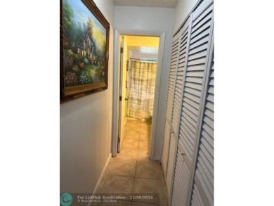 Beautiful water view updated 1 bedroom, 1  1/2  bath condo on Sunrise Lakes Phase III in Florida - for sale on GolfHomes.com, golf home, golf lot