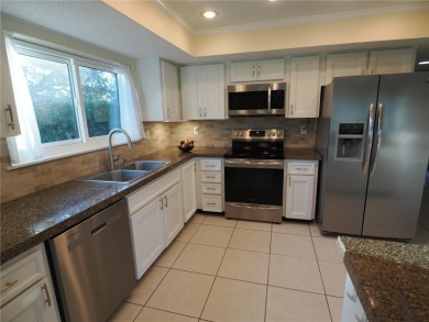 VACATION WHERE YOU LIVE... UNIQUE RARE OPPORTUNITY to own this on East Lake Woodlands Country Club in Florida - for sale on GolfHomes.com, golf home, golf lot