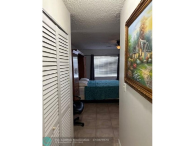 Beautiful water view updated 1 bedroom, 1  1/2  bath condo on Sunrise Lakes Phase III in Florida - for sale on GolfHomes.com, golf home, golf lot