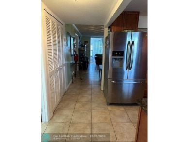 Beautiful water view updated 1 bedroom, 1  1/2  bath condo on Sunrise Lakes Phase III in Florida - for sale on GolfHomes.com, golf home, golf lot