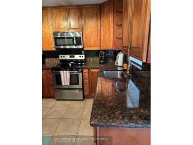 Beautiful water view updated 1 bedroom, 1  1/2  bath condo on Sunrise Lakes Phase III in Florida - for sale on GolfHomes.com, golf home, golf lot
