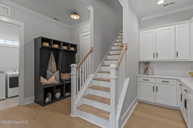 Welcome to this stunning residence nestled in the prestigious on Cape Fear National At Brunswick Forest in North Carolina - for sale on GolfHomes.com, golf home, golf lot